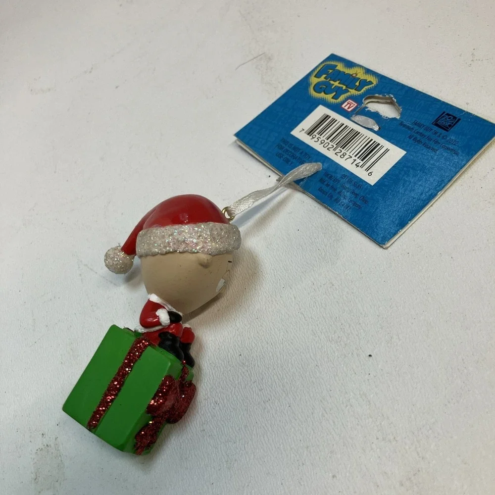 2011 Family Guy's Stewie Sitting On Green Present Christmas Ornament NOS